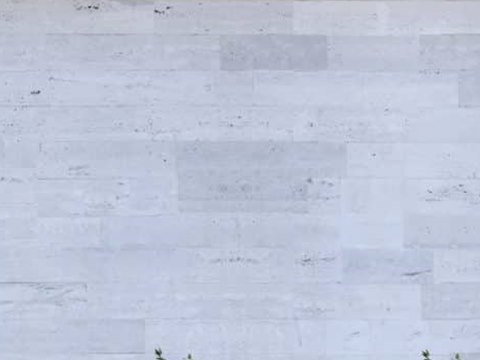 The Frame material palette — Pale stone cladding