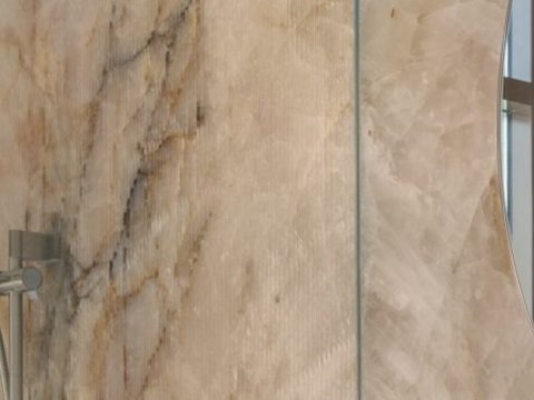 262 | Villa K material palette — Honey-veined stone